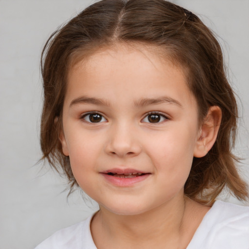 Joyful white child female with medium  brown hair and brown eyes