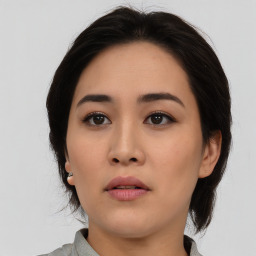 Neutral asian young-adult female with medium  brown hair and brown eyes