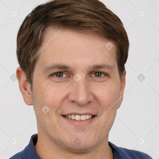 Joyful white adult male with short  brown hair and brown eyes