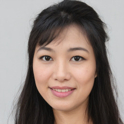 Joyful asian young-adult female with long  brown hair and brown eyes