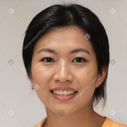 Joyful asian young-adult female with medium  black hair and brown eyes