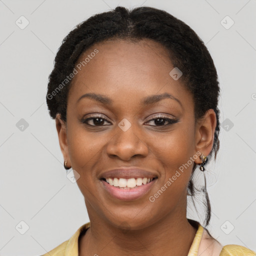 Joyful black young-adult female with short  brown hair and brown eyes