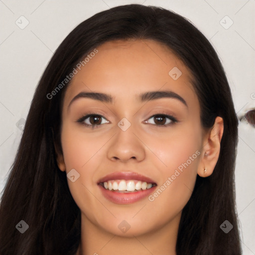 Joyful latino young-adult female with long  black hair and brown eyes