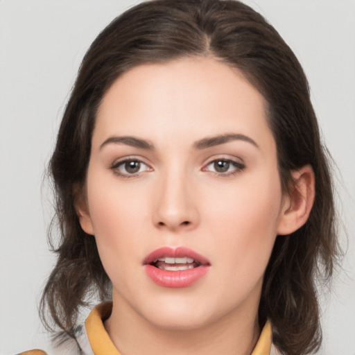 Neutral white young-adult female with medium  brown hair and brown eyes