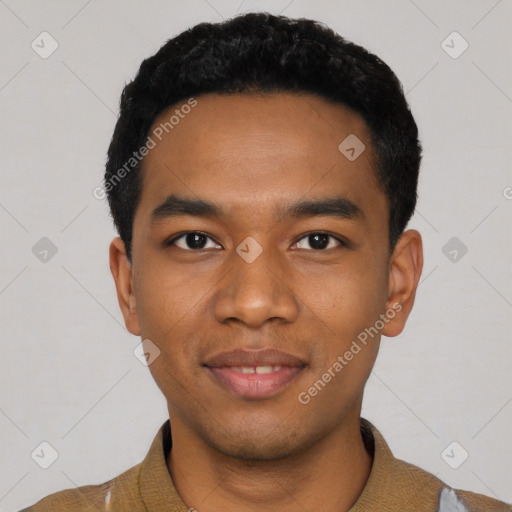 Joyful black young-adult male with short  black hair and brown eyes