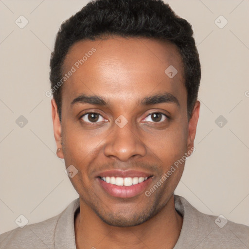 Joyful black young-adult male with short  black hair and brown eyes