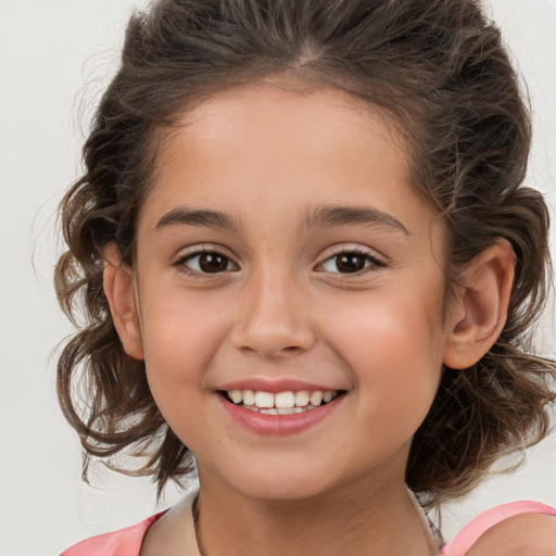 Joyful white child female with medium  brown hair and brown eyes