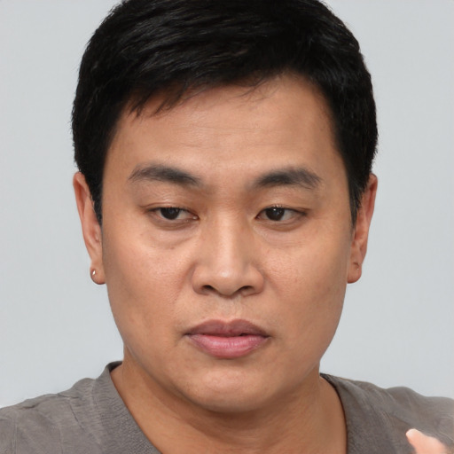 Neutral asian young-adult male with short  black hair and brown eyes