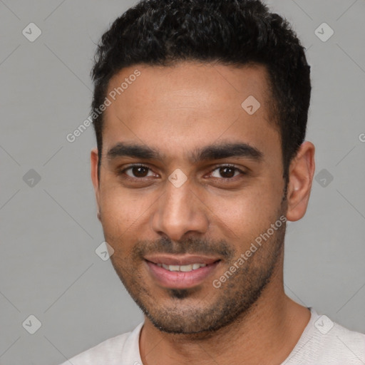 Joyful white young-adult male with short  black hair and brown eyes