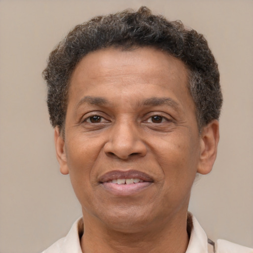 Joyful latino adult male with short  brown hair and brown eyes