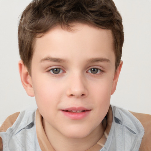 Joyful white child male with short  brown hair and brown eyes