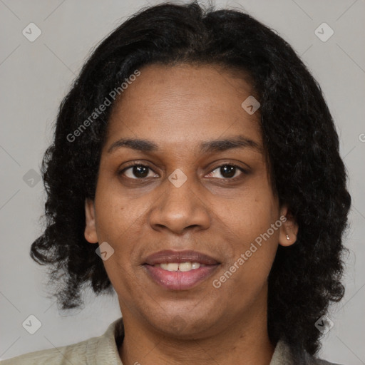 Joyful black adult female with medium  black hair and brown eyes