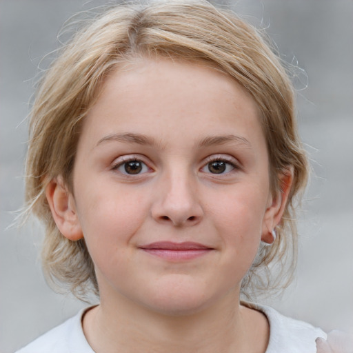 Joyful white child female with medium  brown hair and blue eyes