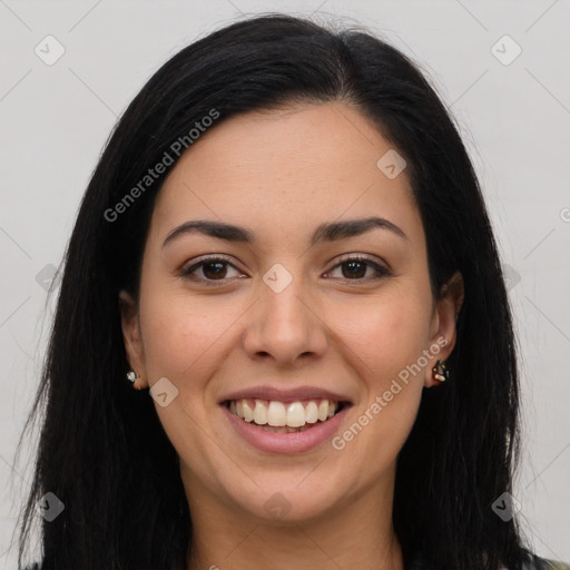 Joyful latino young-adult female with long  brown hair and brown eyes