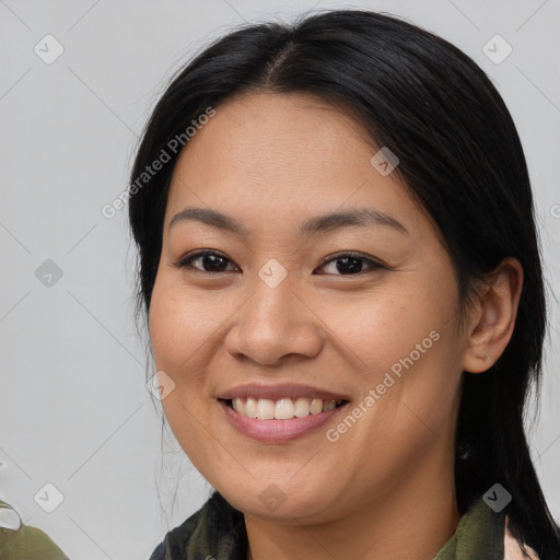 Joyful asian young-adult female with medium  brown hair and brown eyes