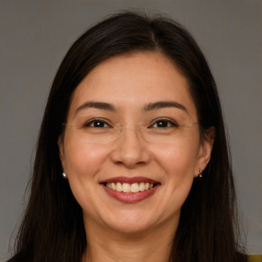 Joyful white adult female with long  brown hair and brown eyes