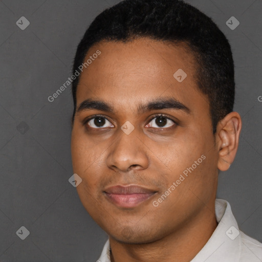 Joyful black young-adult male with short  brown hair and brown eyes