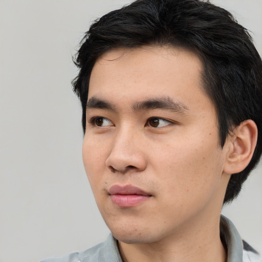 Neutral white young-adult male with short  black hair and brown eyes