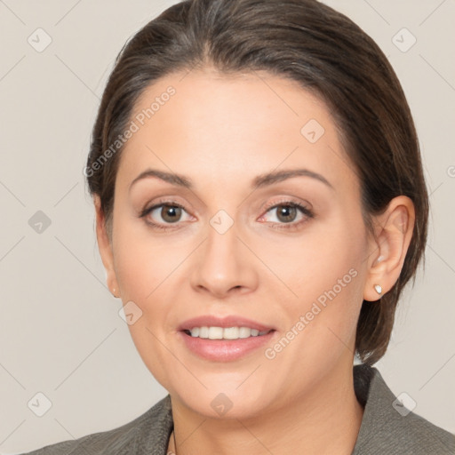 Joyful white adult female with medium  brown hair and brown eyes