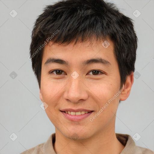 Joyful asian young-adult male with short  brown hair and brown eyes