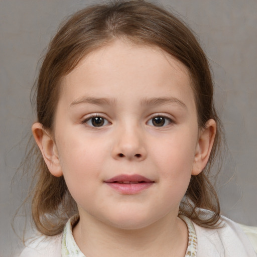 Joyful white child female with medium  brown hair and brown eyes