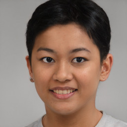 Joyful asian young-adult female with short  brown hair and brown eyes