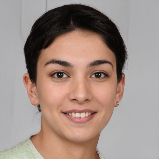 Joyful white young-adult female with short  brown hair and brown eyes