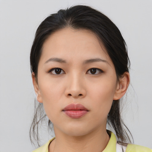Neutral asian young-adult female with medium  black hair and brown eyes