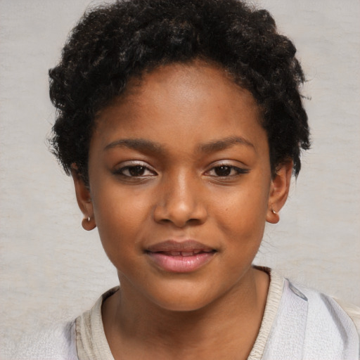 Joyful black child female with short  brown hair and brown eyes