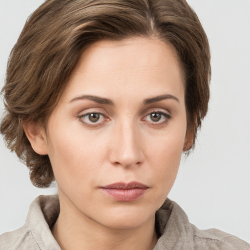 Neutral white young-adult female with medium  brown hair and grey eyes