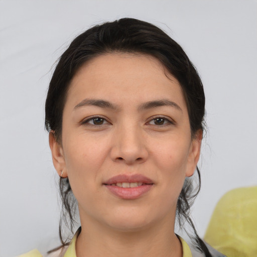 Joyful white young-adult female with medium  brown hair and brown eyes