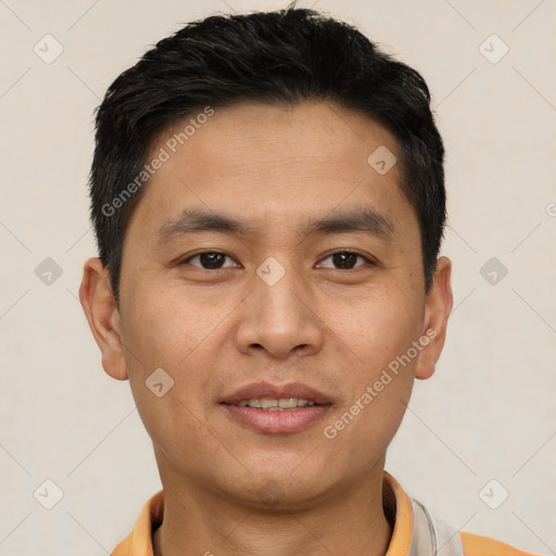 Joyful asian young-adult male with short  black hair and brown eyes