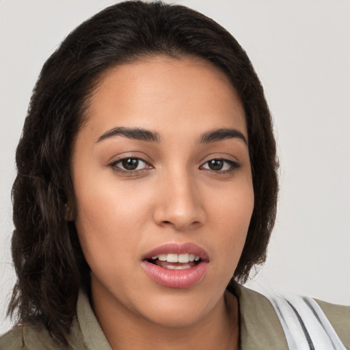 Joyful white young-adult female with long  brown hair and brown eyes