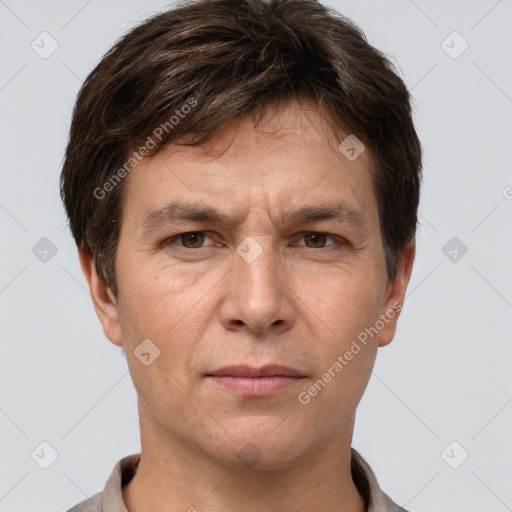 Joyful white adult male with short  brown hair and grey eyes