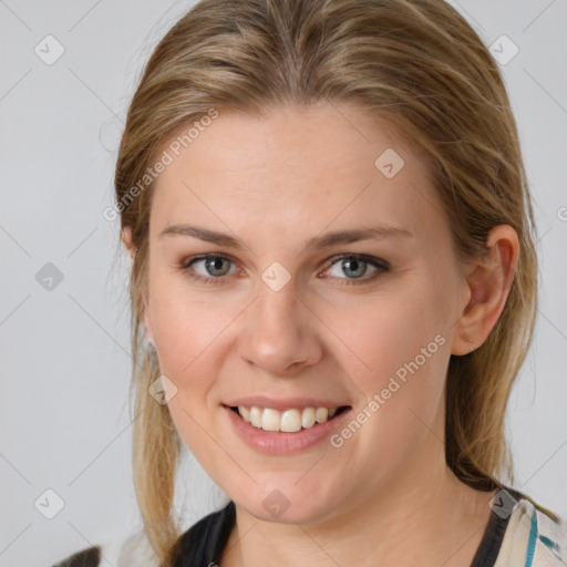 Joyful white young-adult female with medium  brown hair and blue eyes