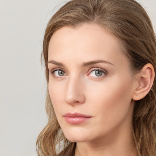 Neutral white young-adult female with long  brown hair and blue eyes