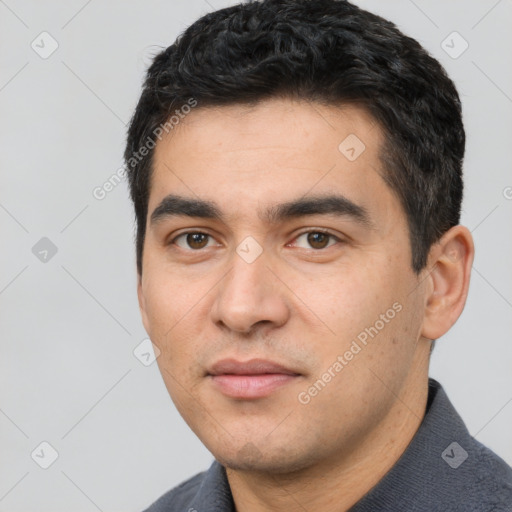 Joyful white young-adult male with short  black hair and brown eyes