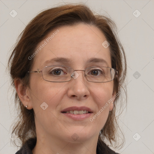 Joyful white adult female with medium  brown hair and blue eyes