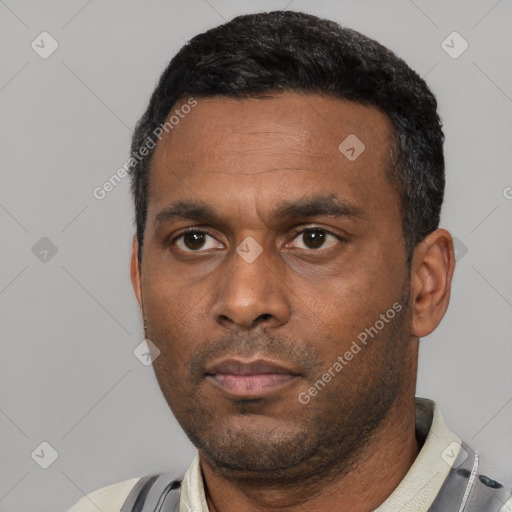 Neutral latino young-adult male with short  black hair and brown eyes