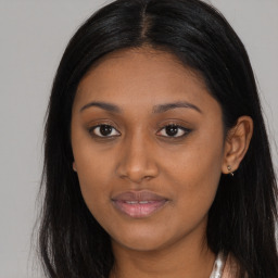 Joyful asian young-adult female with long  brown hair and brown eyes