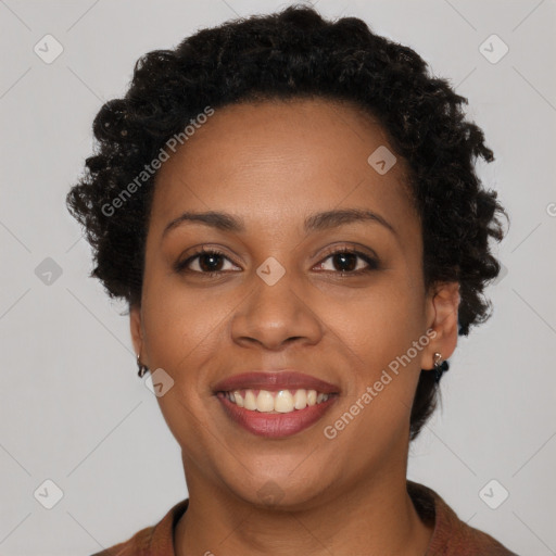 Joyful black young-adult female with short  brown hair and brown eyes