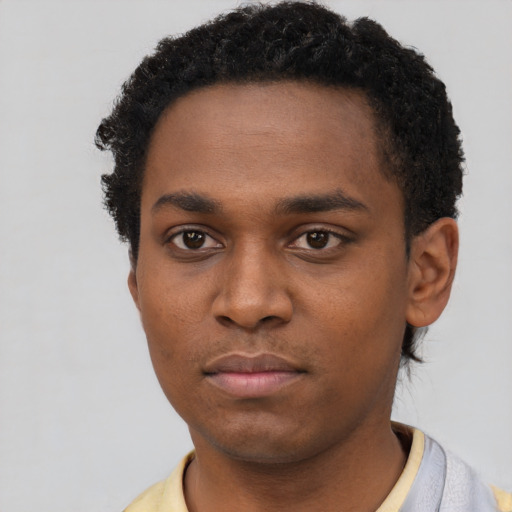 Neutral black young-adult male with short  black hair and brown eyes