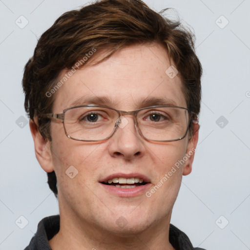 Joyful white adult male with short  brown hair and grey eyes