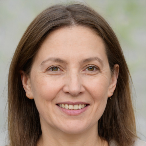 Joyful white adult female with medium  brown hair and brown eyes