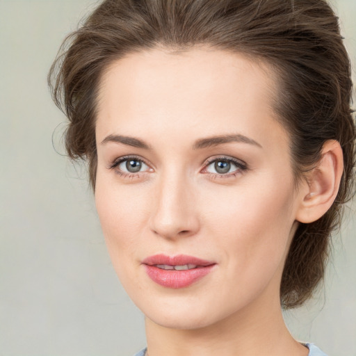 Joyful white young-adult female with medium  brown hair and green eyes