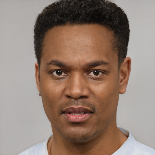 Neutral black young-adult male with short  black hair and brown eyes