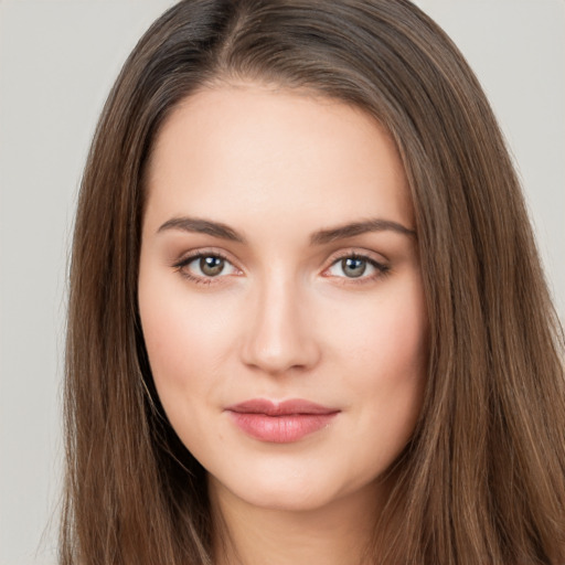 Neutral white young-adult female with long  brown hair and brown eyes