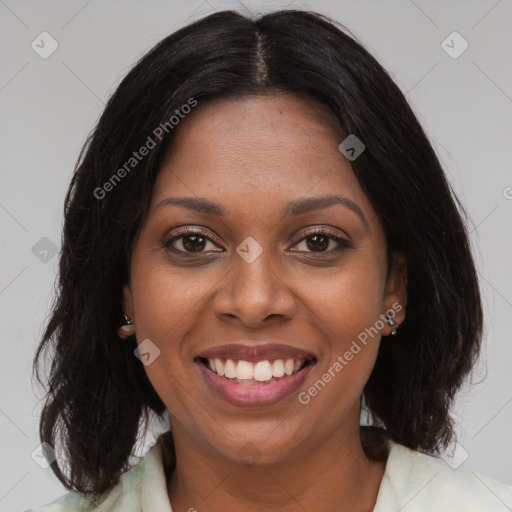 Joyful black young-adult female with medium  brown hair and brown eyes