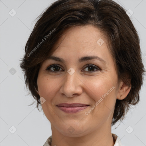 Joyful white adult female with medium  brown hair and brown eyes