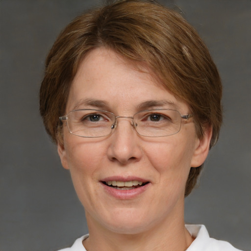 Joyful white adult female with short  brown hair and brown eyes